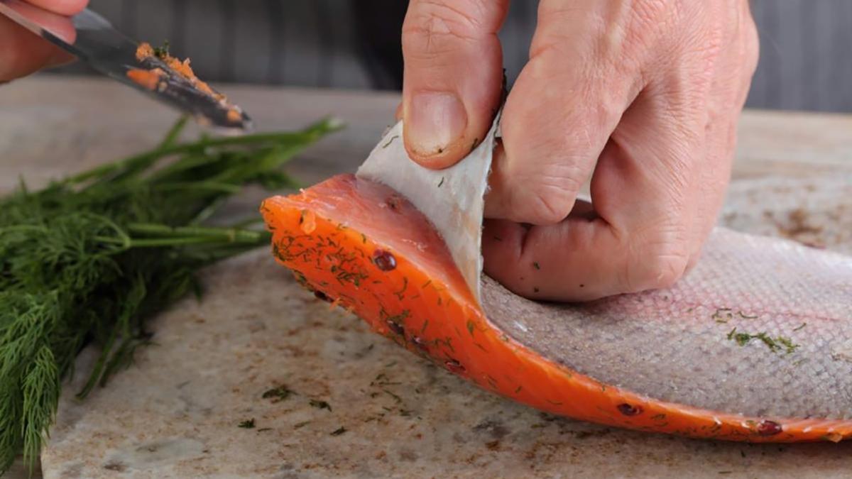 salmon skin being removed