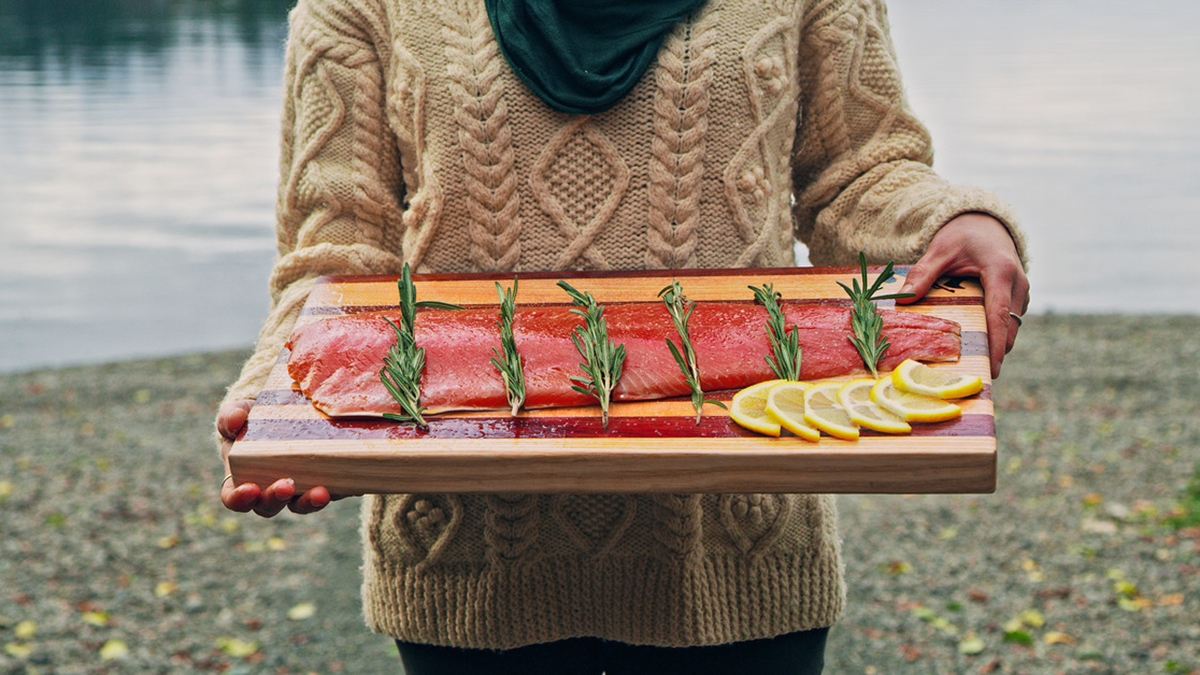 featured catch woman holding salmon