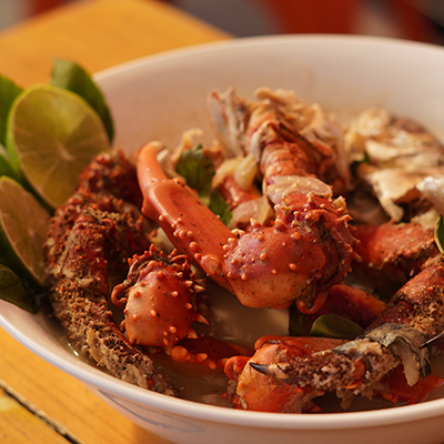 Sopa marinera, fish soup, with crab, coconut milk, and more in a bowl.