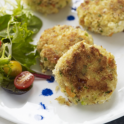 Seafood recipes with a plate of crab cakes and greens