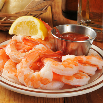 Seafood recipes with a plate of shrimp and cocktail sauce