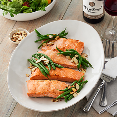 Thanksgiving fish recipes with a platter of poached salmon and green beans