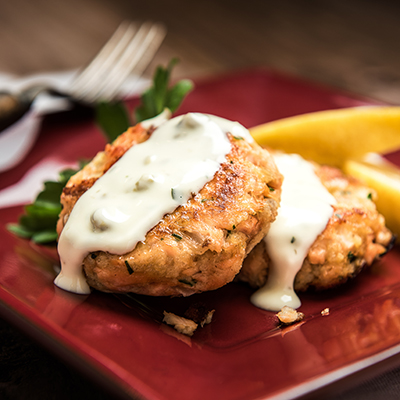 Thanksgiving fish recipes with two salmon cakes on a plate