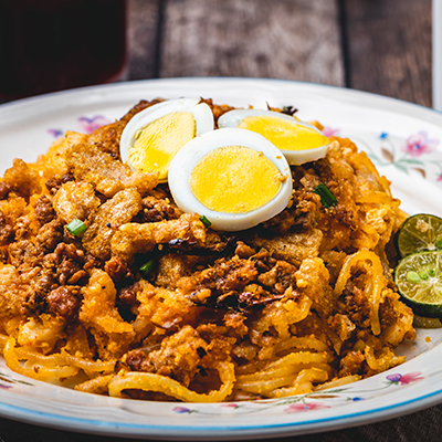 Christmas fish dishes with a plate of pancit malabon, a Thai fish dish.