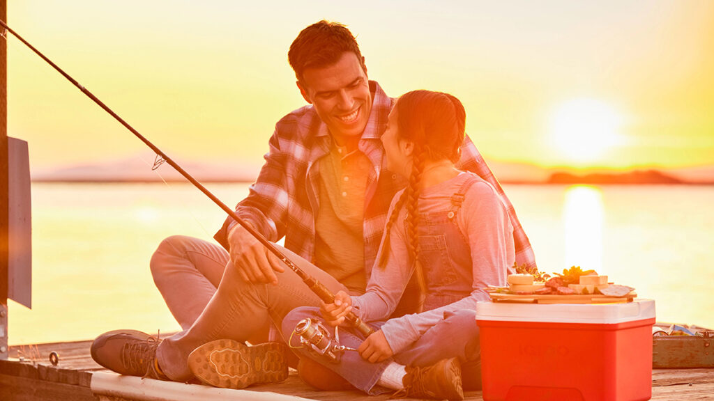 Reasons to love fish with a father and daughter sitting on a dock fishing.