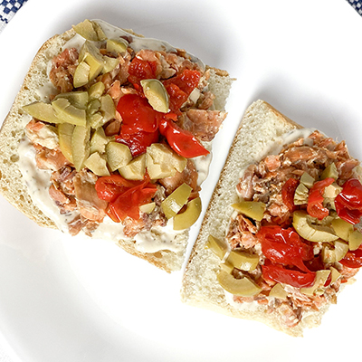 Nioise salmon sandwich on a plate